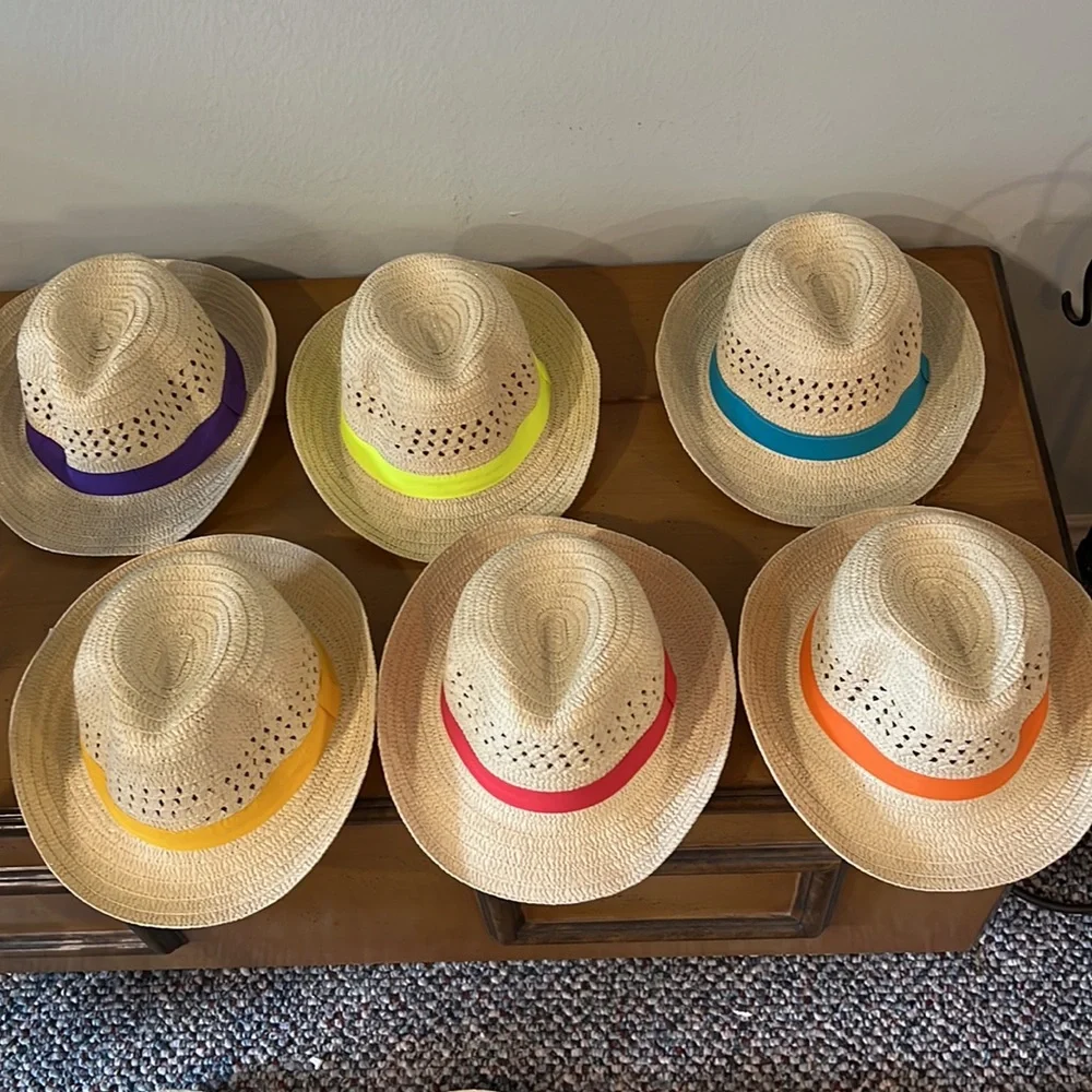 Straw adult fedora style hats.